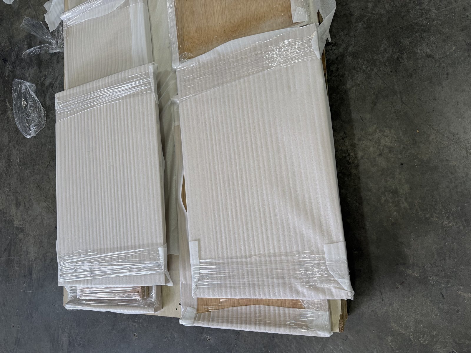 Cabinet Doors Wrapped for Transit — Cabinets by Oaktree custom cabinetry