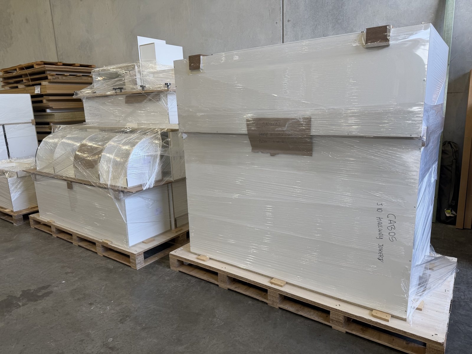 Wrapped Orders Staged for Dispatch — Cabinets by Oaktree custom cabinetry